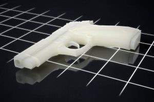 Digital illustration of a white pistol on a dark grid